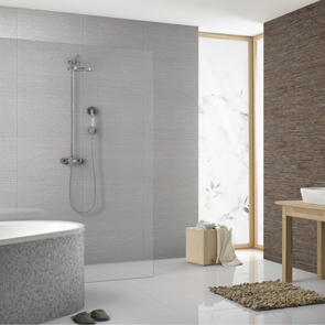 White large floor tiles in modern bathroom with both grey and brown textured wall tiles.
