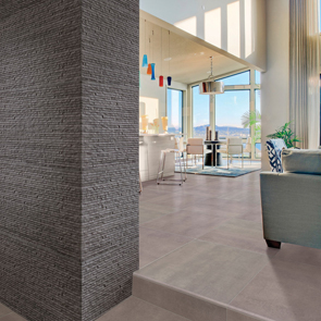 Textured anthracite grey wall tiles and grey floor tiles.