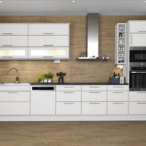 Modern gloss white kitchen tiled on the floor and splashback in treverkever sand tiles.