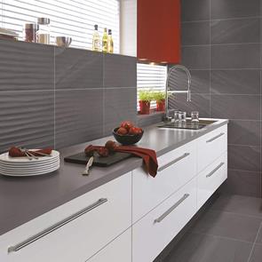 British Stone Anthracite Wave decoarative tile in a modern kitchen with matching floor and wall tiles