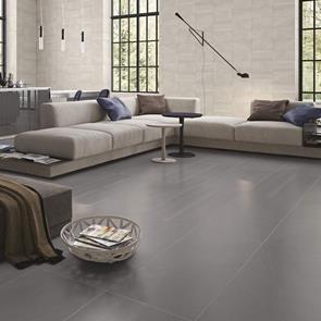 British Stone Large format anthracite tile in a large living room with contrasting white walls