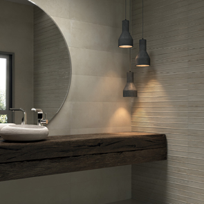 Bridge relief beige matt tile features on the wall in a luxary bathroom alongside smooth beige tile. 