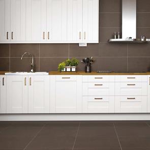 Traffic Mocha Structured Tile on wall and floor of kitchen space where the worktop is located.