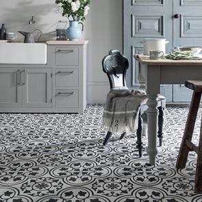 Cuban white ornate tile in a traditional styled kitchen with shaker style cabinets and belfast sink