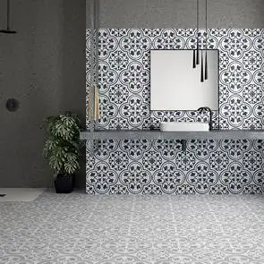 Cuban silver ornate tile in a large open plan bathroom with contrasting cuban white ornate tile being used as a feature wall with wall hung mirror and sinks