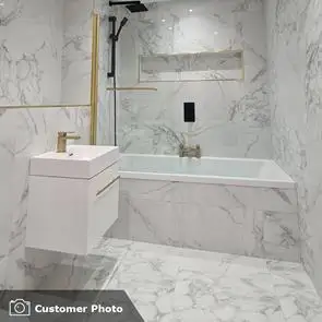 Lassen Carrara (white) gloss marble effect tile on modern bathroom wall and floor