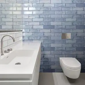 Arles Sea Gloss Blue Tile with Arles Snow Gloss Tile Brick Bonded onto Bathroom wall