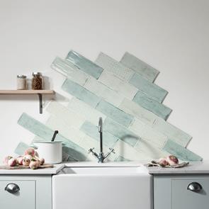 Arles cream and green décor mix tiled herringbone style on kitchen wall