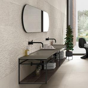 Knole cream floor and wall tiles in stylish bathroom with textured décor feature wall