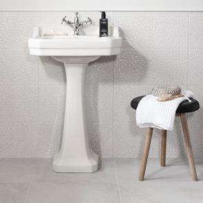 Traditional bathroom featuring white floor tiles and coordinating white hexagon decors from the Cliveden tile collection