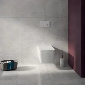 The Marmori 1200x600 tile in a bathroom setting with wall mounted bathroom suite and accent pink wall