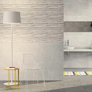 400x250 Dovedale light grey relief décor with complimenting wall tiles and floor tiles in a open plan bathroom