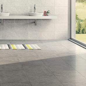 450x450 Dovedale light grey floor tile in a open space with wall hung sinks and modern fixings