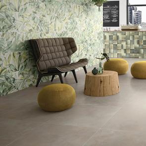 The urban light grey in a spacious reception area with floral wall pattern and contrasting yellow furniture