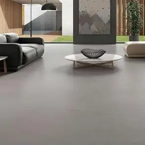 Core Concrete 900x900mm tile in a modern living room with designed sofas and large window space