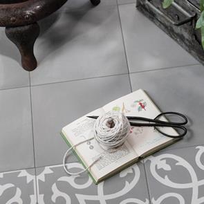 Contrasti Girgio plain tile on the floor, with complimenting feature with book and scissors