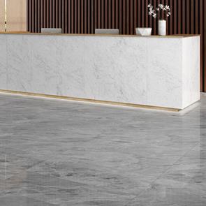 Marmori cloud grey tile in a reception lobby with Marmori calacatta welcome desk