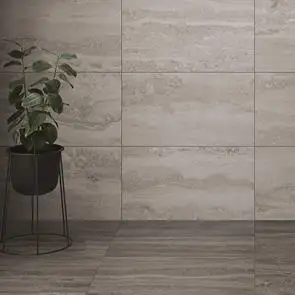 Brescia Grey Travertine Effect Tile shown on floor with plant