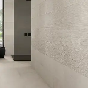 Modern cream bathroom tiled with Knole floor and wall tiles and textured wall décors