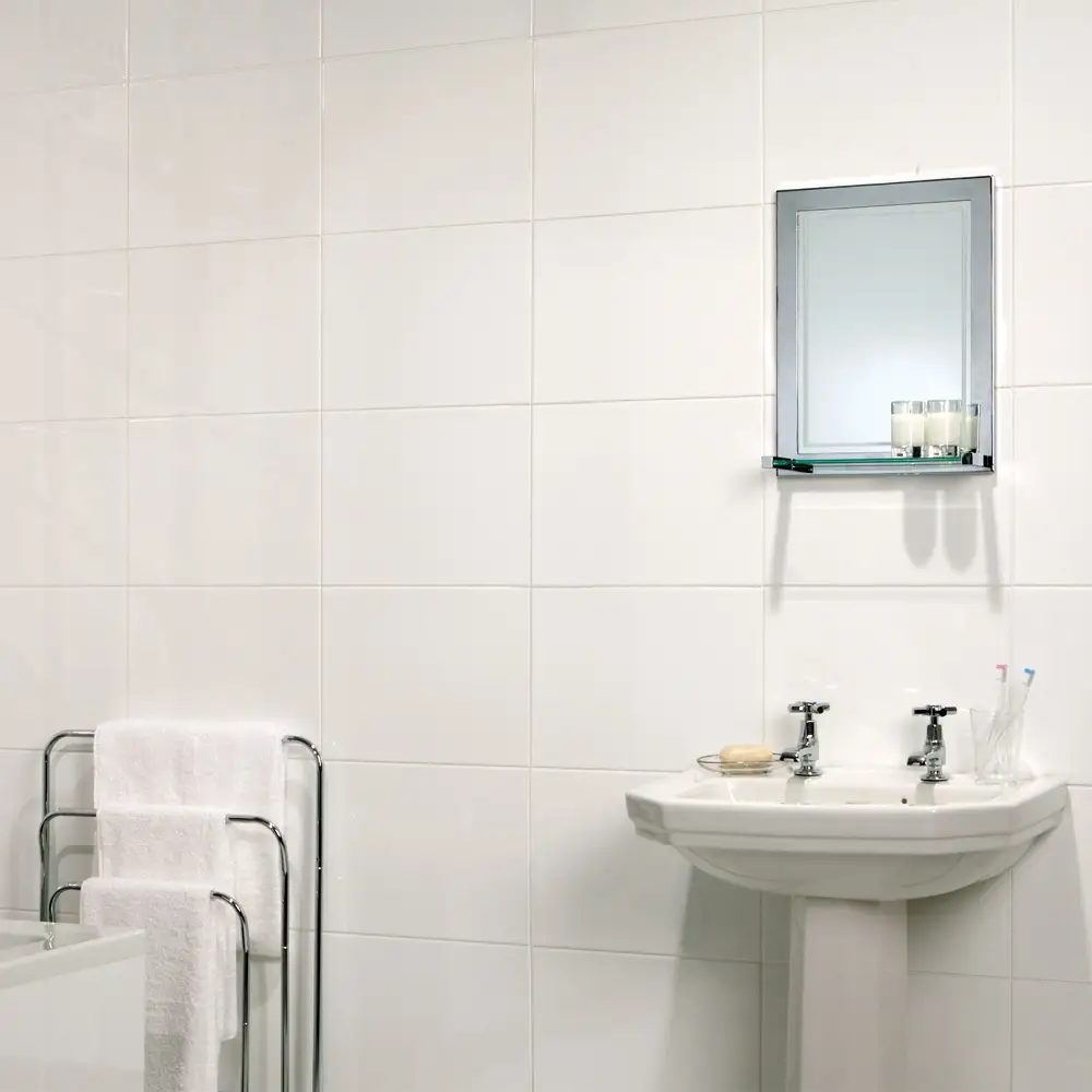 The tundra white gloss fully tiled bathroom with traditional styled basin and pedestal