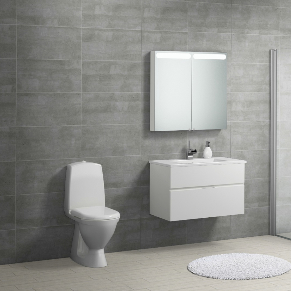 Large open plan bathroom with the 600x300 Sherwood grey tile fully tiled on a wall with gloss white furnishings.