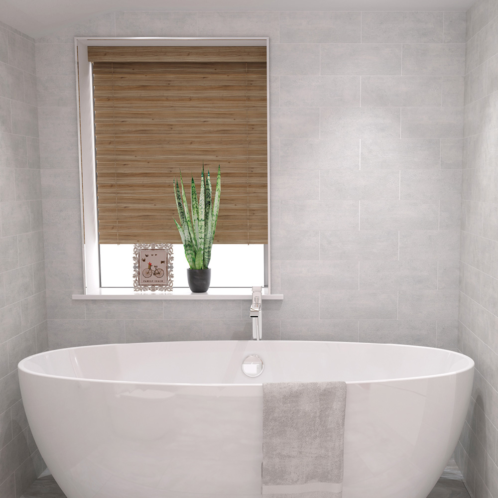 Concrete whitewash ceramic tile behind a freestanding bath with Woodeffect blinds