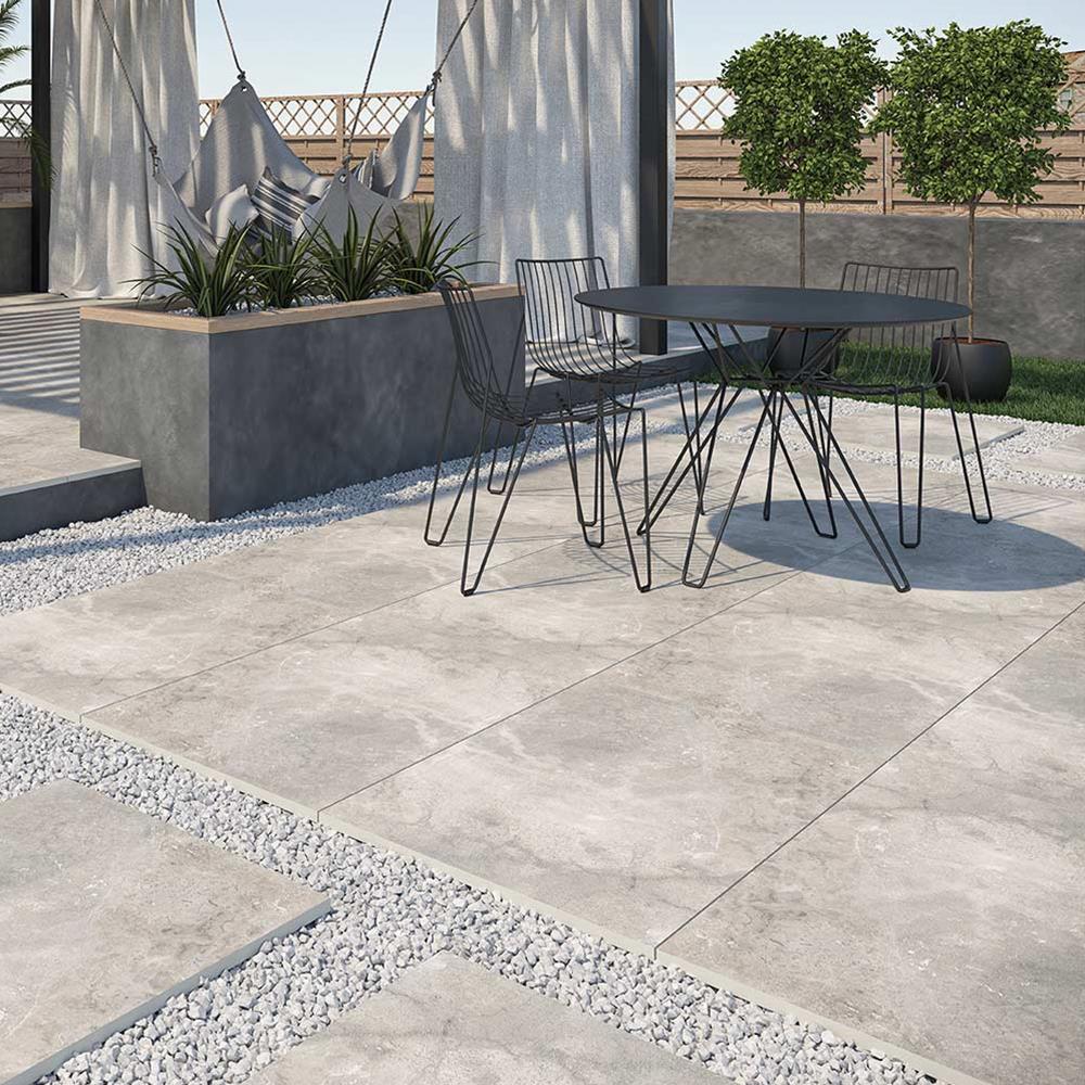 Burlington Silver outdoor 2cm porcelain tile on a external patio with contrasting black garden furniture
