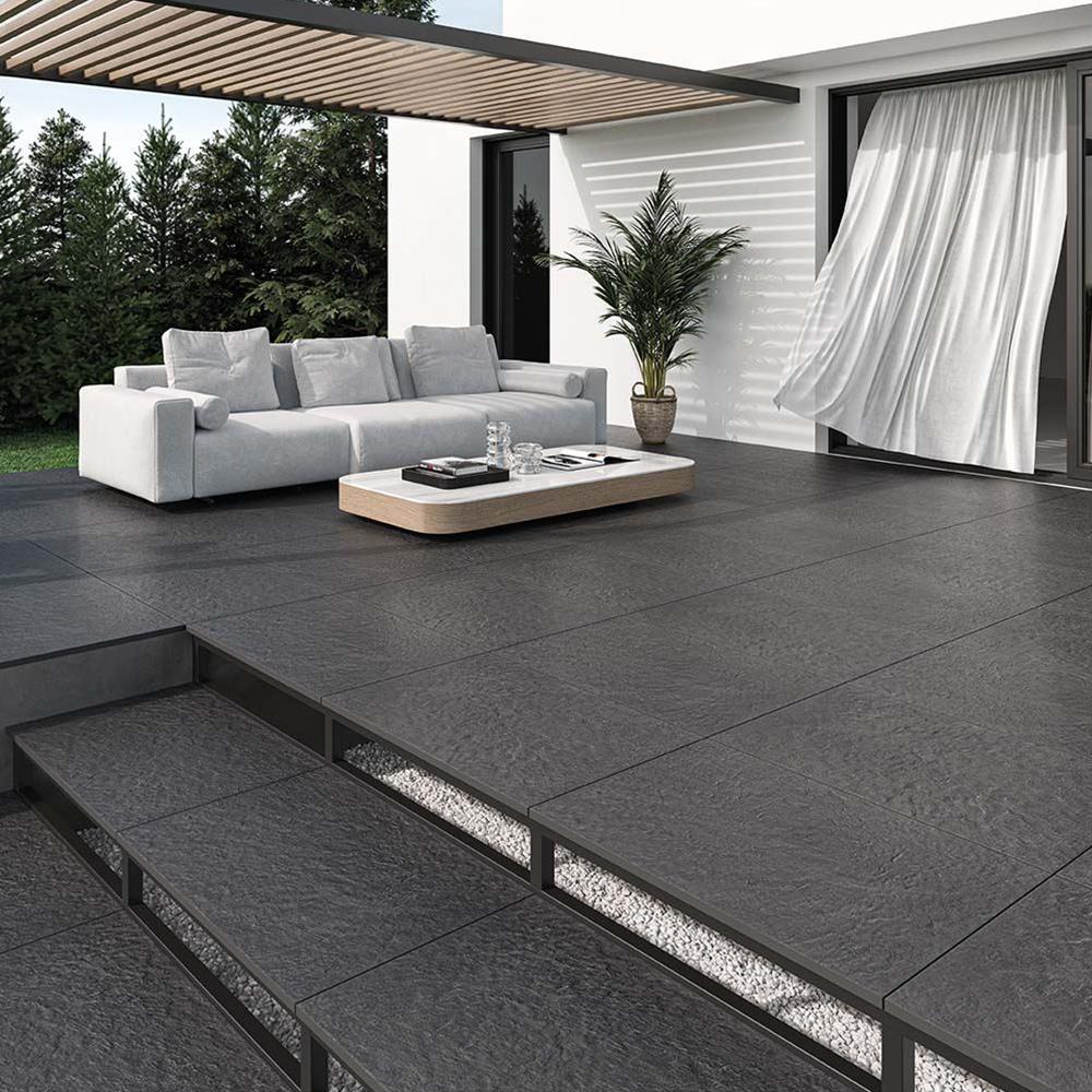 Minster Black Outdoor Tile in a garden patio
