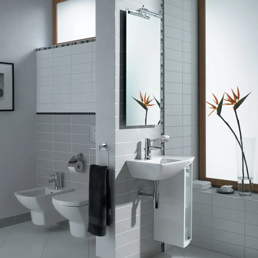 Contemporary designed bathroom with step grey gloss tiles half tiled around a wall hung toilet and bidet,#