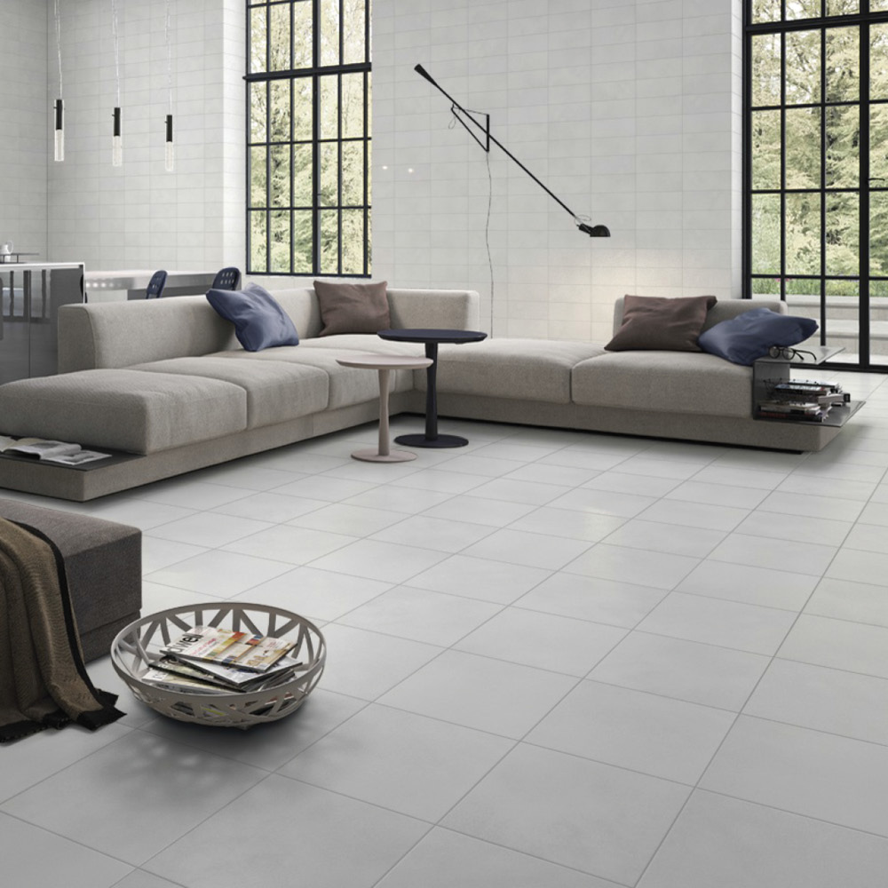 Bloom white floor tile in a modern open plan living room with Cream suite