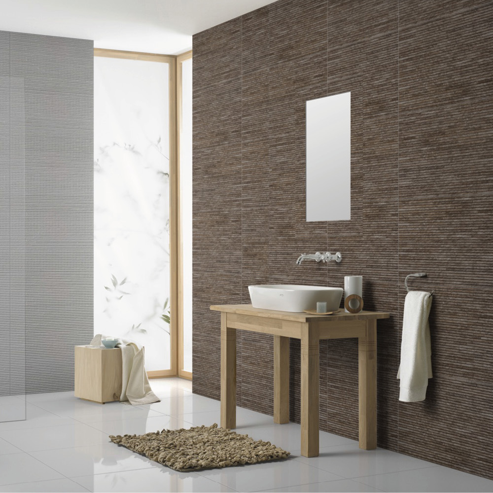 Montecarlo beige/brown split face tile in a large wetroom with freestanding oak vanity and matching beige rug