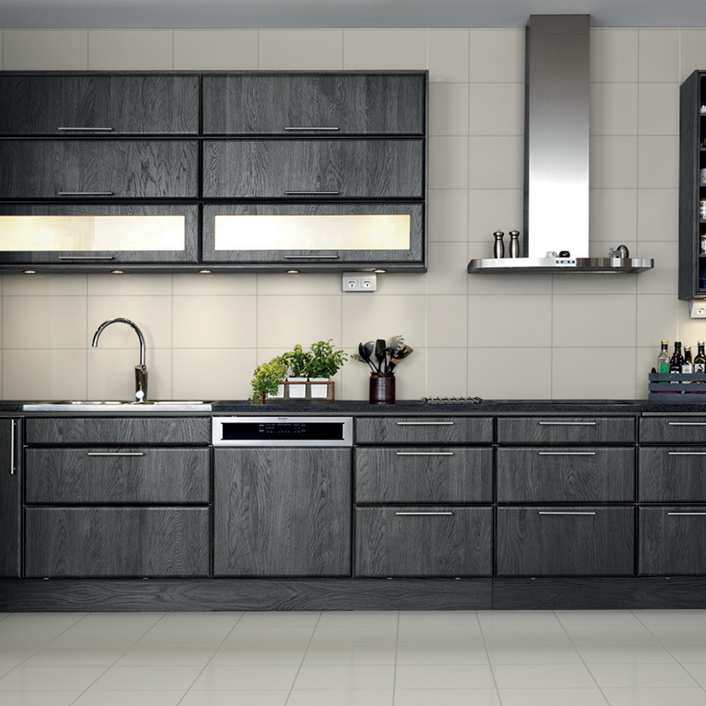 Dark oak kitchen with contrasting gloss white bumpy tiles fully tiled above.