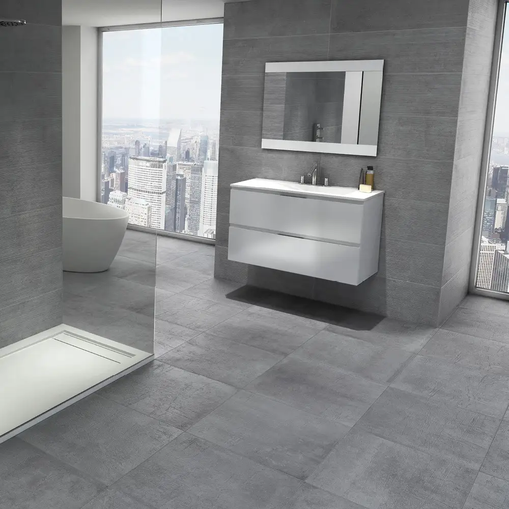 Timeless gris tile in a open bathroom setting with matching floor tile ,contrasting against the wall hung vanity unit