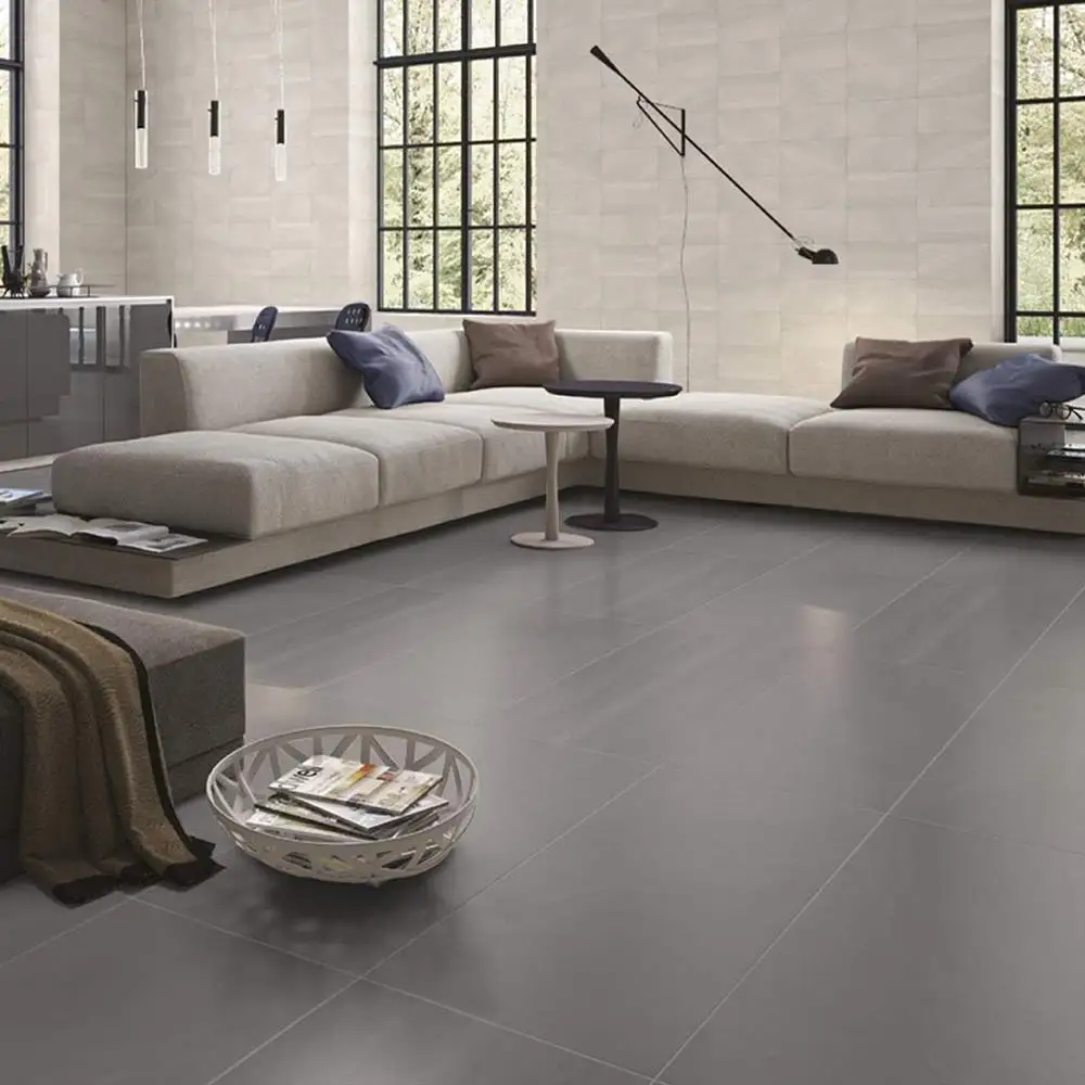 British Stone Large format anthracite tile in a large living room with contrasting white walls