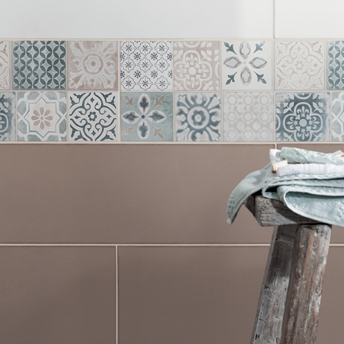 Patterned small tiles paired with khaki coloured wall tiles