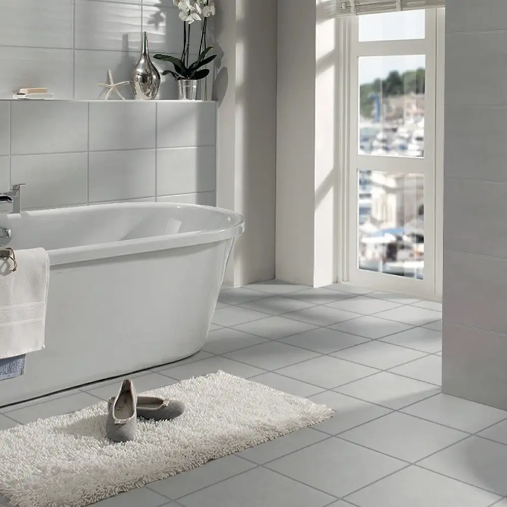 300x300 Metro grey in a bathroom setting with cream rug and freestanding bath
