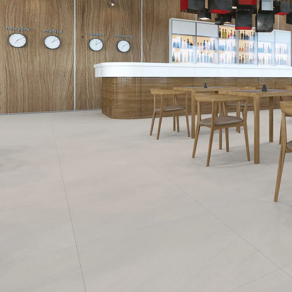Kursaal pure soft grip anti slip tile being used on the floor in a large bar area with contrasting oak furnishings