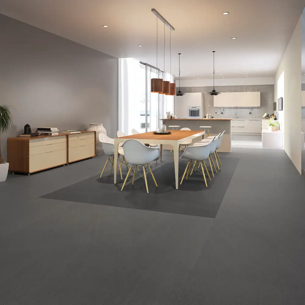 600x300 Kursaal raven soft grip tile used as a contrasting dark floor tile in a open plan dining room with white and oak furniture