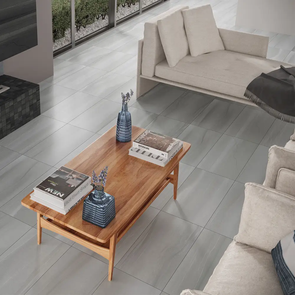 The linear grey tile on the floor in a living room with cream sofa and oak coffee table