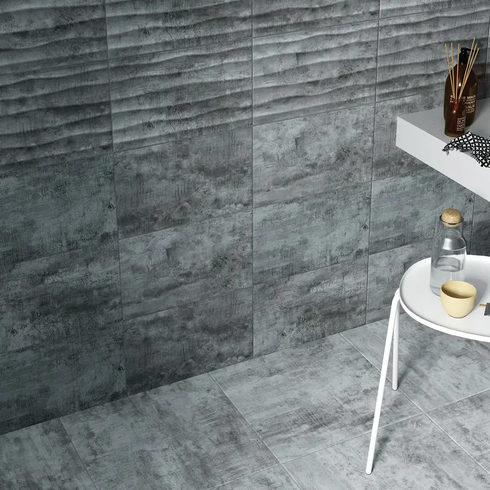 Cosy grey décor tile being used as a feature band in a modern bathroom with matching wall and floor tiles
