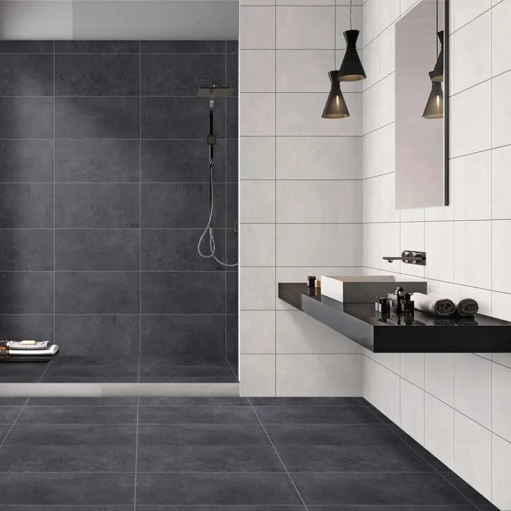 Spacious bathroom setting with black wall hung shelf with sink on sink and the traffic anthracite tiles used to create a feature contrasting the traffic white