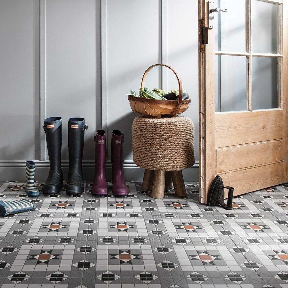 traditional styled hall way with the kendal grey tile on the floor with oak door and wicker basket