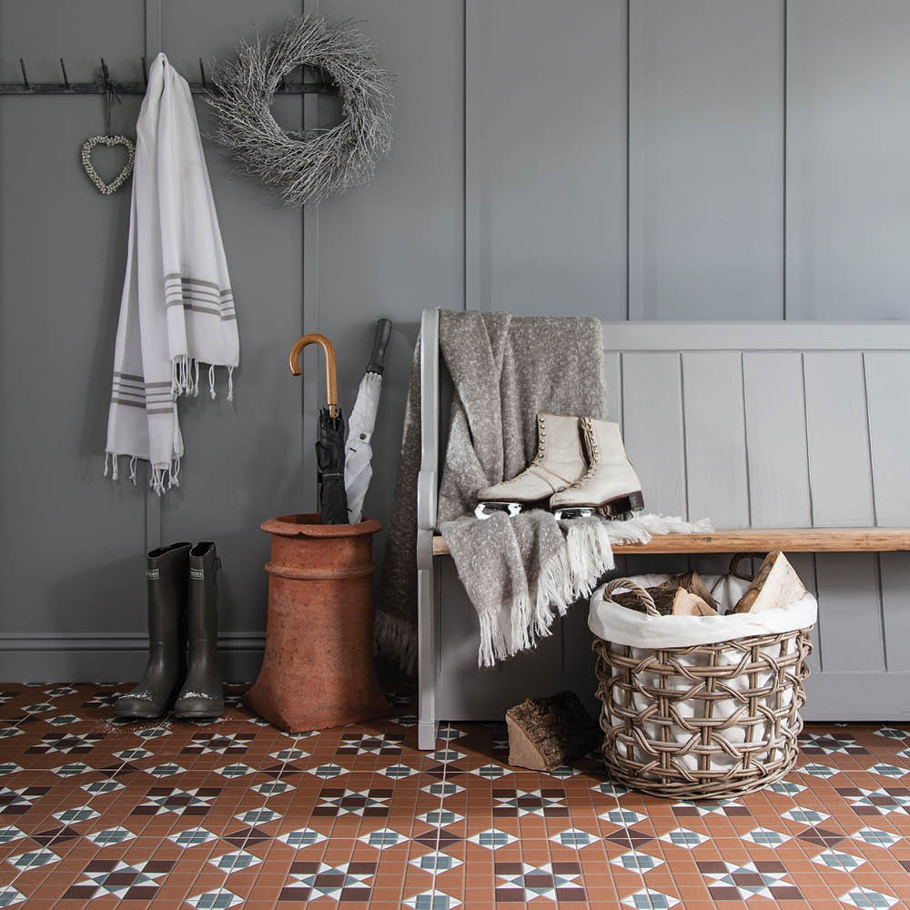 York terracotta tile in a traditional styled hallway with neutral grey bench and grey wall pannels