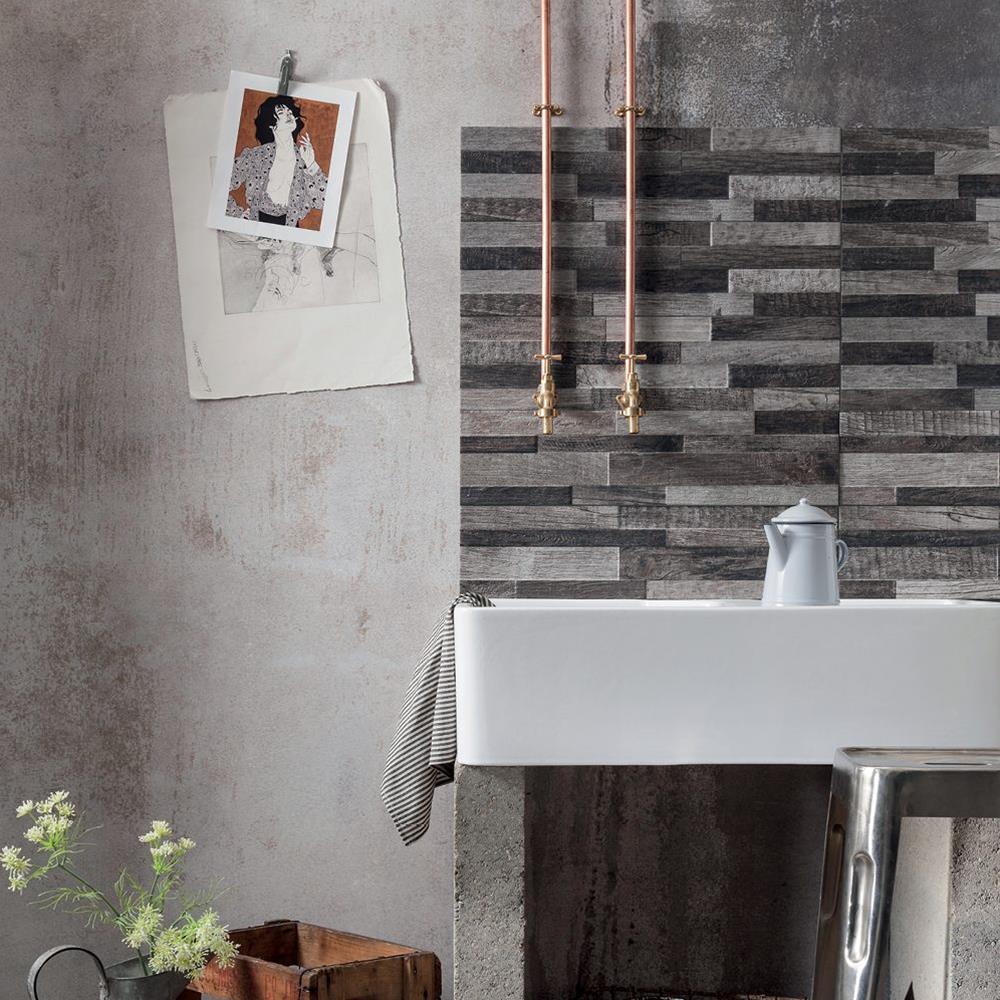 The inwood black tile used as a splash back feature above a wall mounted sink