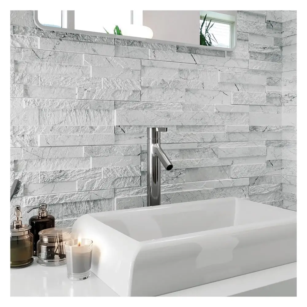 Gloss white ceramic sink infront of a fully tiled wall in the tiffany white range of porcelain slate effect tiles.