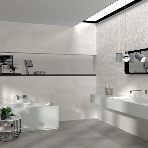 Modern bathroom suite with wall hung sink and taps, with the rust white tile on coordinating walls.