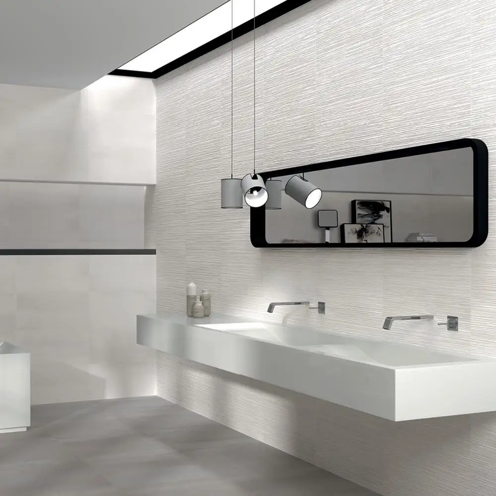 Modern bathroom design with white furnishings, contrasting black mirror and 600x300 Timeless scraped décor being used as a feature wall.