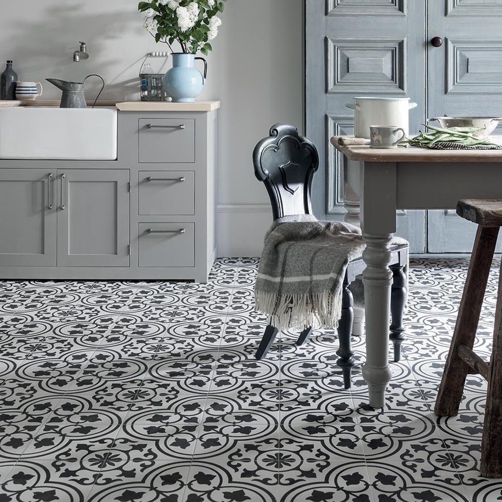 Cuban white ornate tile in a traditional styled kitchen with shaker style cabinets and belfast sink