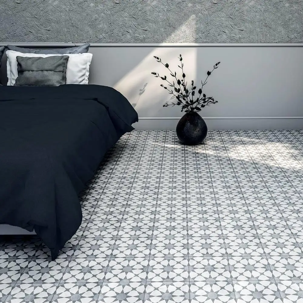 Cuban silver star tile in a modern bedroom, with contrastic black bed & Plant pot
