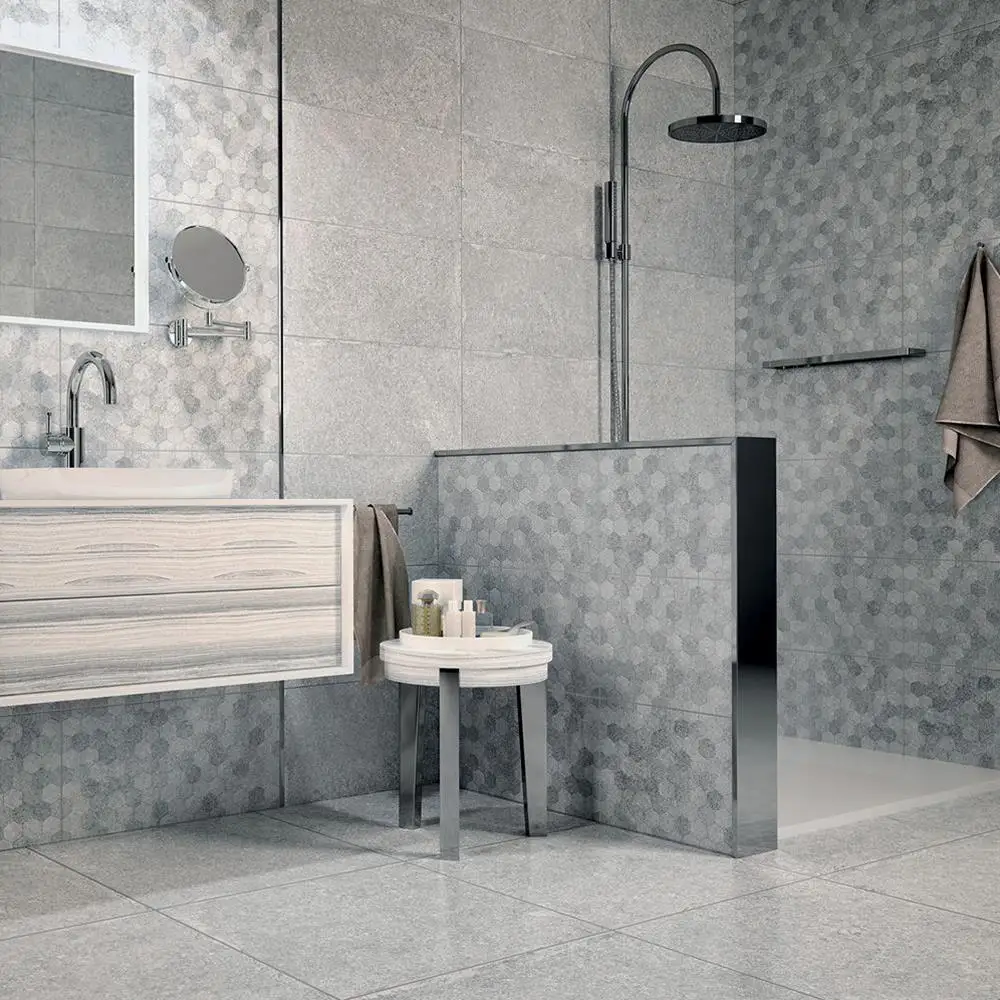Buxy Gris ceramic wall tile being used on accenting walls with matching hexagon décor tile